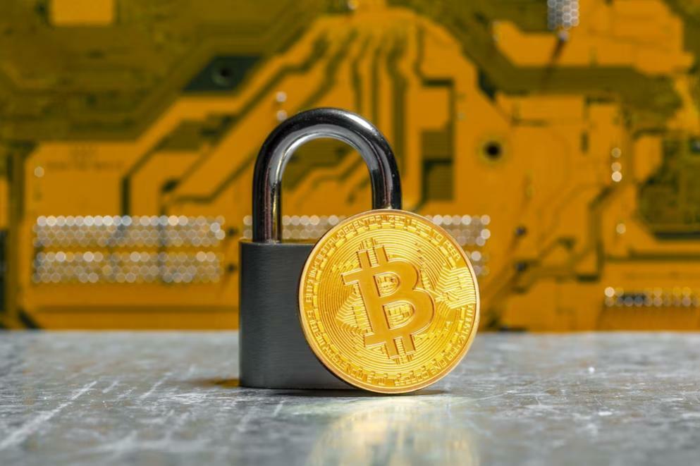 Is Binance safe? Padlock and Bitcoin on orange background
