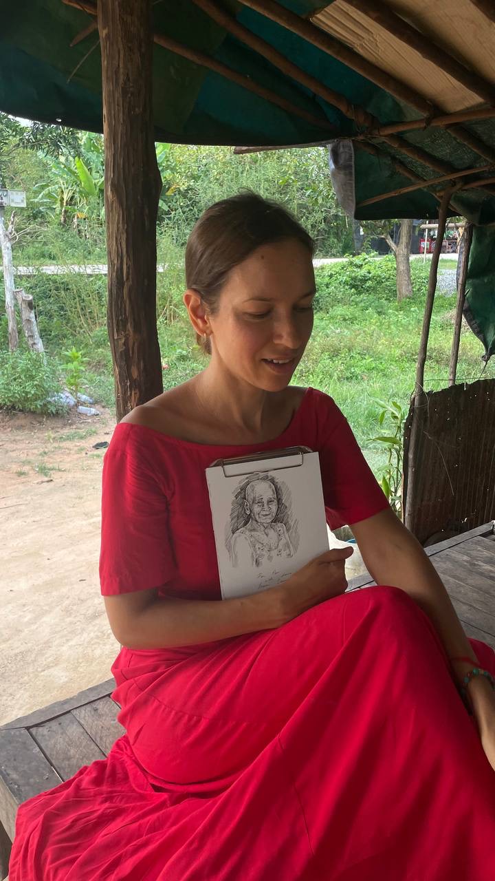 An artist creating a personal pencil portrait drawing