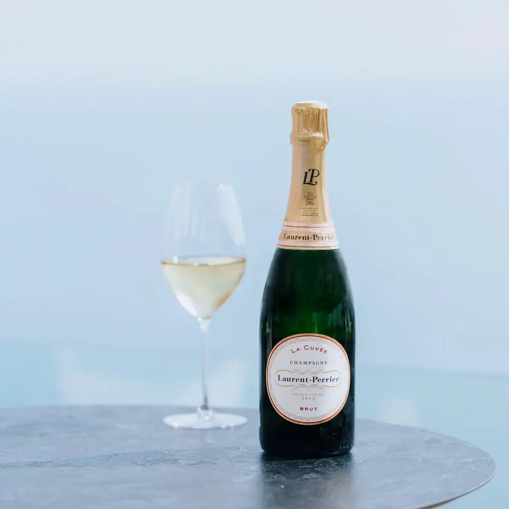 A premium bottle of Laurent-Perrier champagne, representing the finest sparkling wine in Bali.