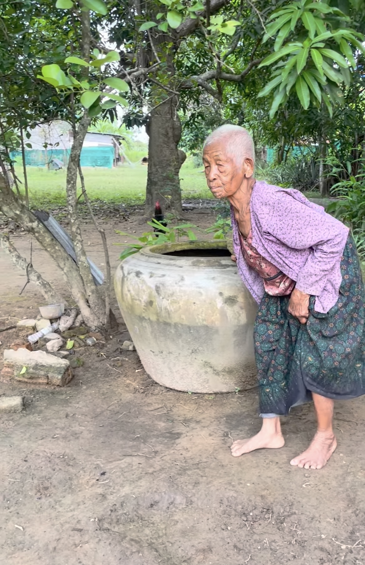 An elderly Cambodian man in a rural setting