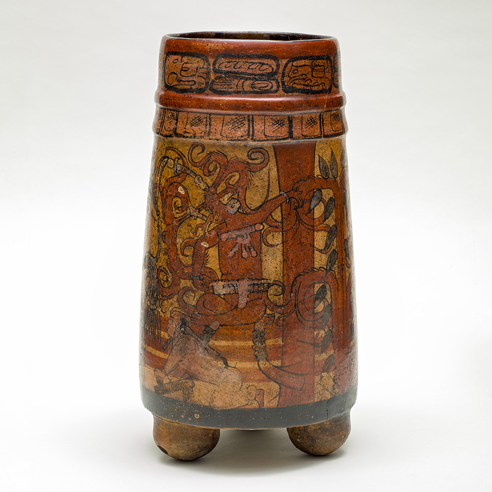 Сосуд. Майя, 750-850 гг. н.э. Человек, изображенный в нижней части сосуда, перетирает зерна какао в пасту. Коллекция Los Angeles County Museum of Art.