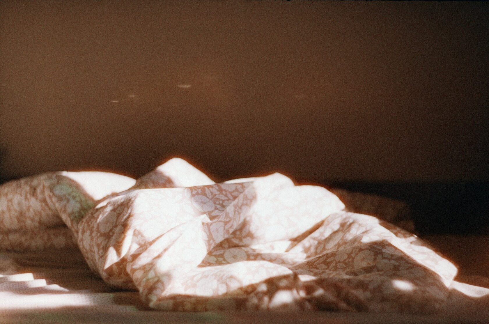 A body under linen, late tropical light — the final, quiet image.
