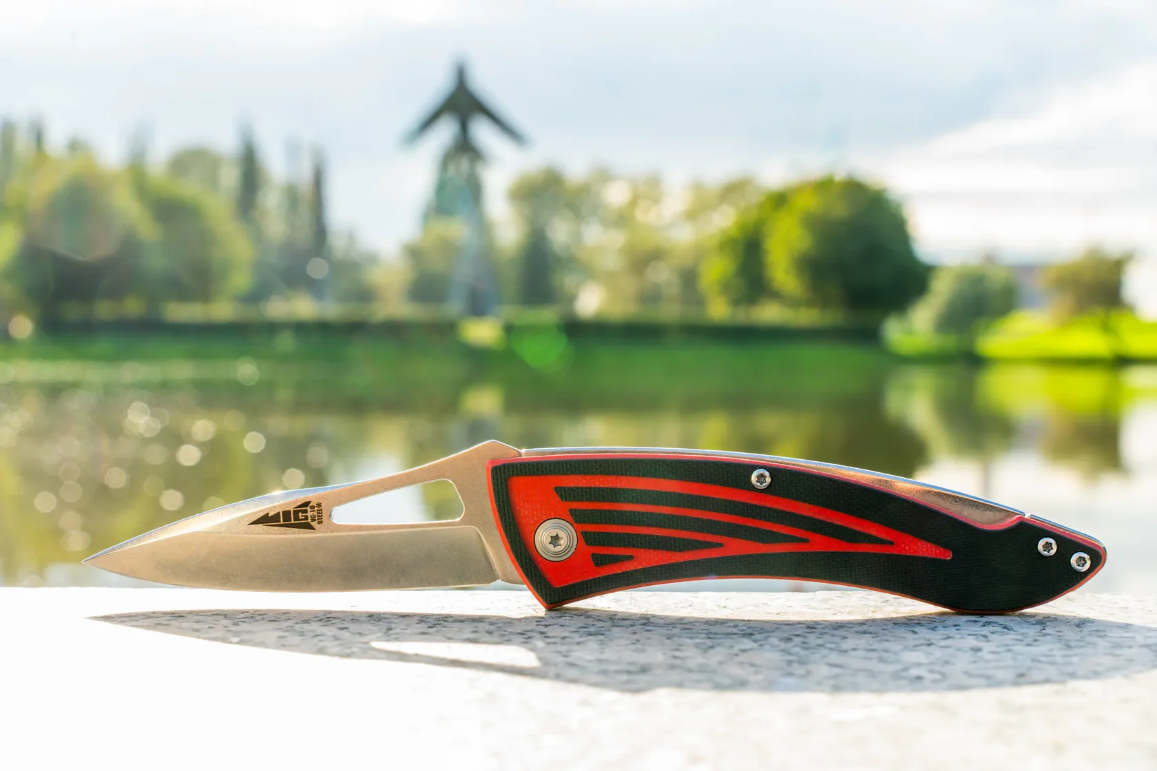 MiG folding knife showing its aircraft-inspired profile outdoors