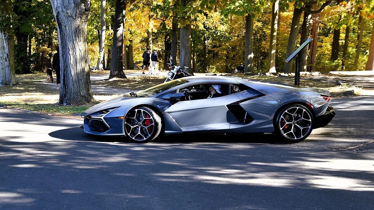 Lamborghini Revuelto on a woodland road — representative model photograph