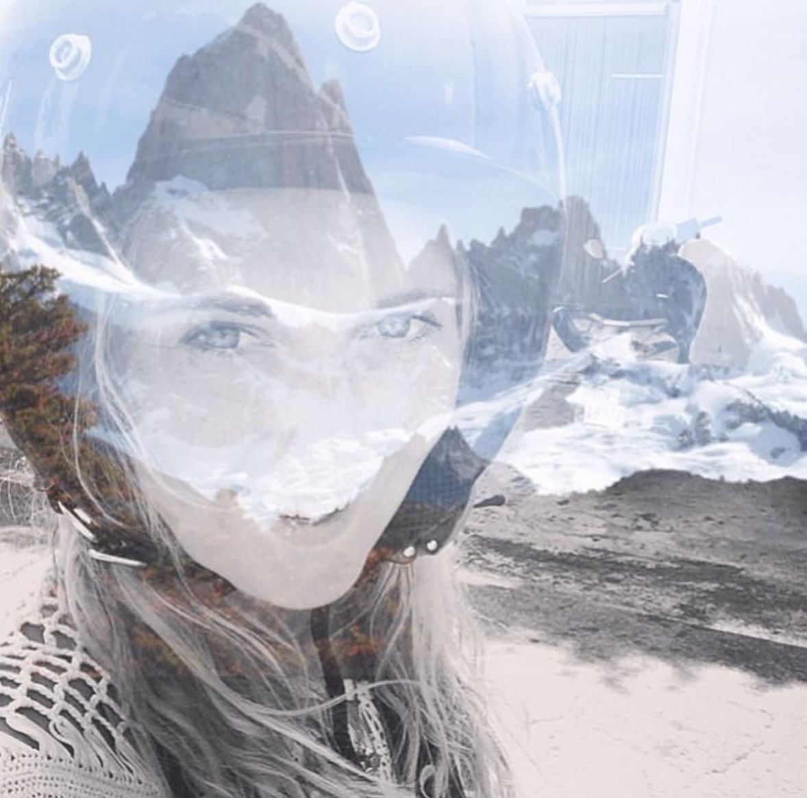 State of mind — double exposure of a face and a mountain ridge at dusk
