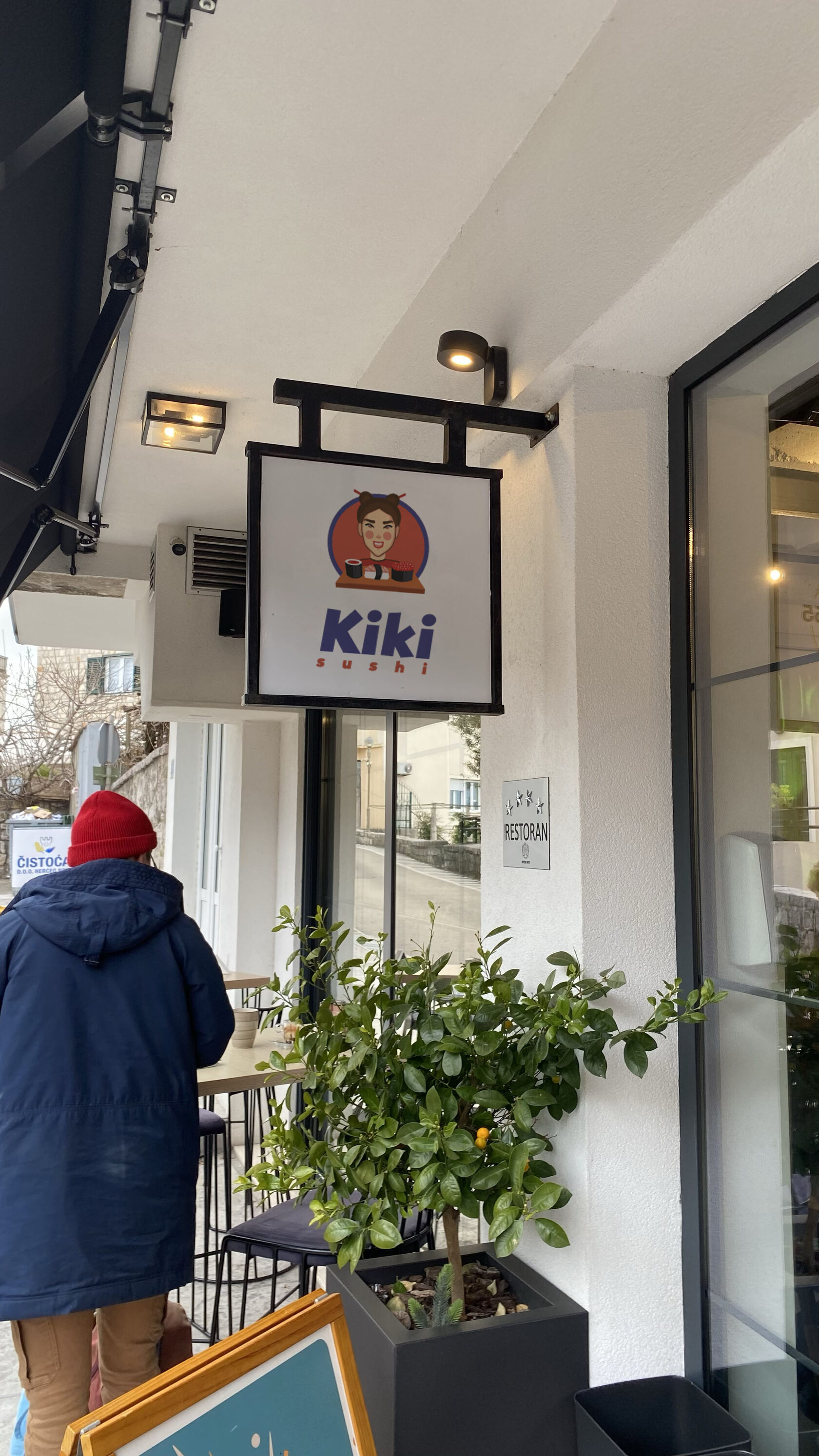 Kiki Sushi branded label applied to delivery containers