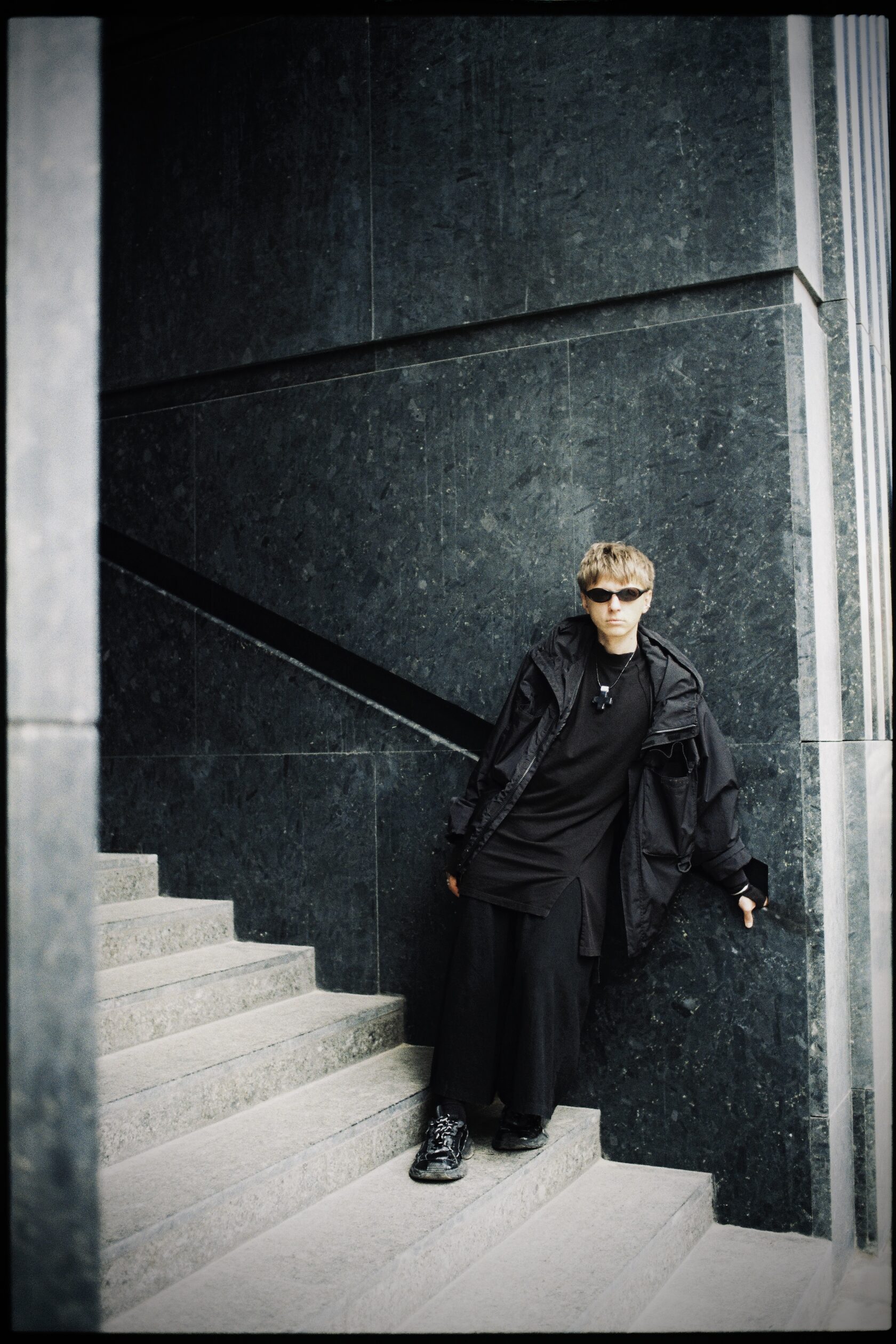 Dima Smolin standing on a stone staircase